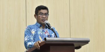 Plt. Kadis Kominfosantik Hadiri Webinar Diseminasi Peraturan KI Standar Layanan Informasi Publik (SLIP)