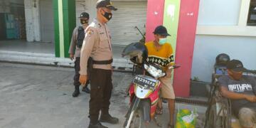 Tim Yustisi Berikan Himbauan Cegah Penyebaran Covid-19 di Pasar Saik