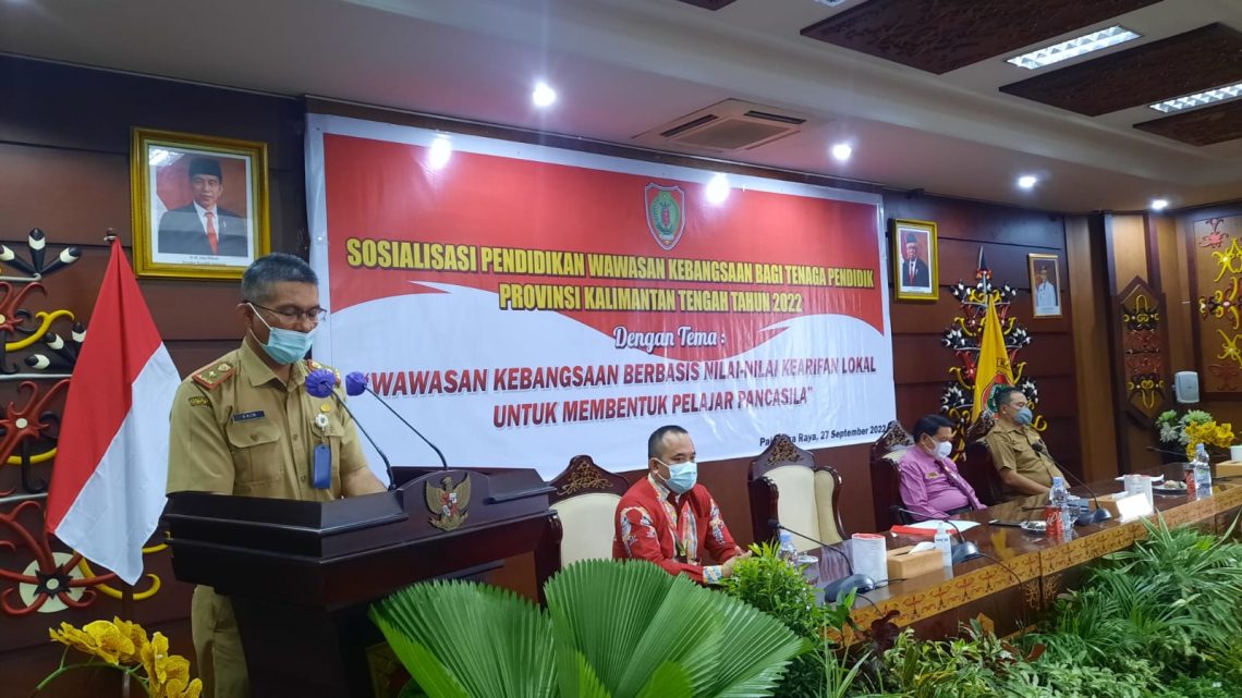 Plt. Kepala Badan Kesbangpol Prov. Kalteng Akhmad Husain saat membacakan sambutan Sekda